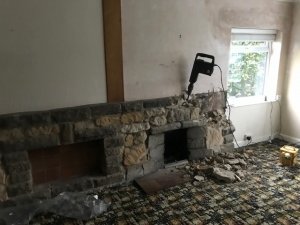Breaking out the old fireplace
